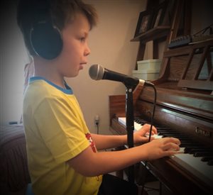 6 year old student singing and playing at lesson!